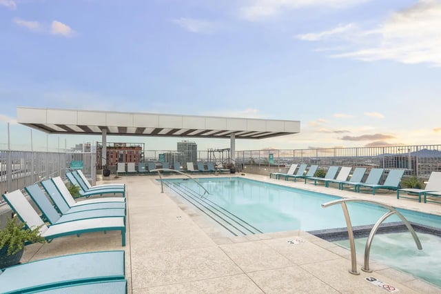 Pool lounge chairs and swimming pool exterior at Atmosphere Tempe in Tempe Student Accommodation