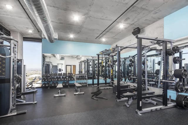 Weights machines racks and dumbbells gym area at Atmosphere Tempe in Tempe Student Accommodation