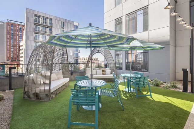 Outdoor seating area with lounge beds and tables exterior at Atmosphere Tempe in Tempe Student Accommodation
