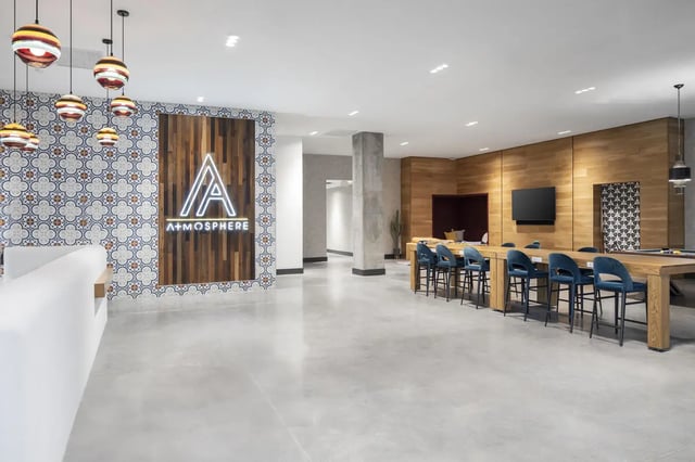 Lounge with bar seating pool table television living room at Atmosphere Tempe in Tempe Student Accommodation