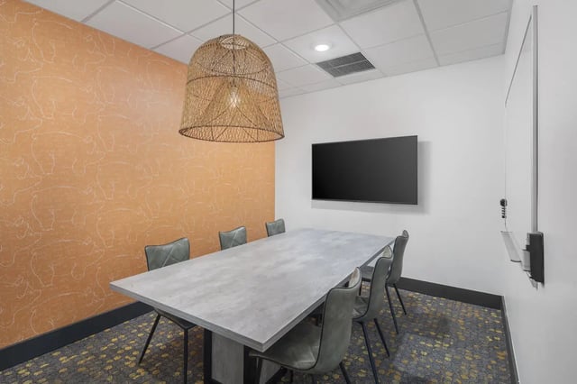 Table chairs screen whiteboard meeting room at Atmosphere Tempe in Tempe Student Accommodation