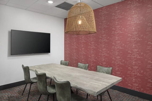 Table with chairs and TV communal room at Atmosphere Tempe in Tempe Student Accommodation