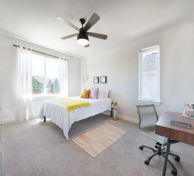 Bed desk fan rug window and ceiling fan bedroom at The Yards at Old State in State College Student Accommodation