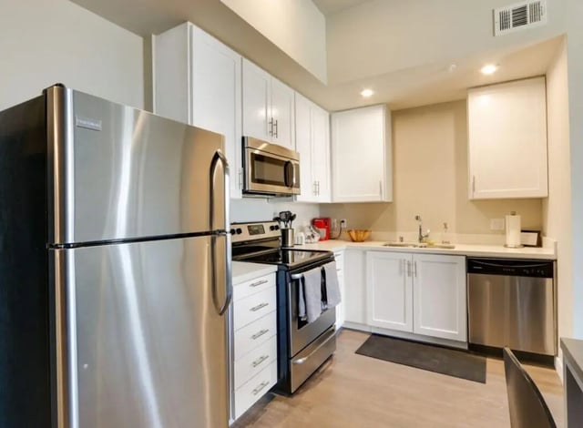 Stainless steel refrigerator stove microwave cabinets kitchen at USC Student Housing: Heritage 1275 in Los Angeles Student Accommodation