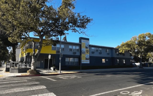 Building with yellow and gray exterior exterior at USC Student Housing: Heritage 2831 in Los Angeles Student Accommodation
