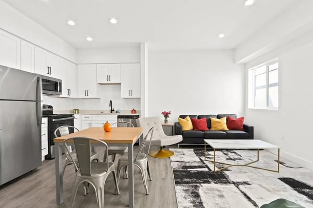 Kitchen dining and living area living room at USC Student Housing: Victory Trio California Suites in Los Angeles Student Accommodation