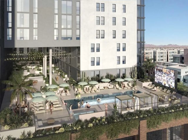 Pool lounge chairs umbrellas and people relaxing outdoors amenity area at Rambler Tempe Apartments in Tempe Student Accommodation