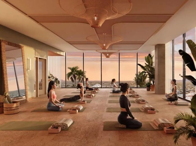Yoga class with students meditating and stretching. Yoga studio at Rambler Tempe Apartments in Tempe Student Accommodation