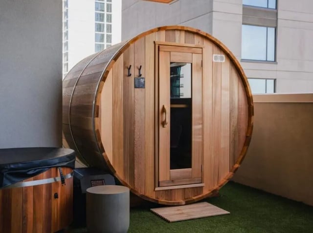 Wooden barrel sauna and hot tub exterior at Rambler Tempe Apartments in Tempe Student Accommodation
