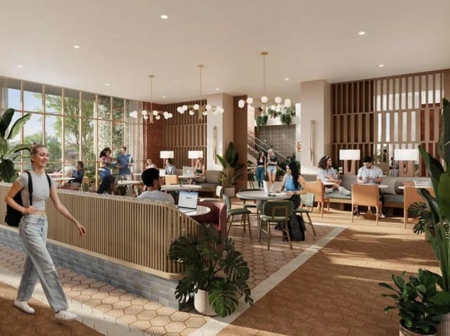 Students in lounge area with tables and seating. at Rambler Tempe Apartments in Tempe Student Accommodation