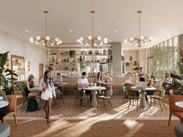 Students study at tables in a communal living room at Rambler Tempe Apartments in Tempe Student Accommodation