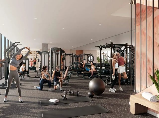 Various people exercise in a modern gym gym at Rambler Tempe Apartments in Tempe Student Accommodation