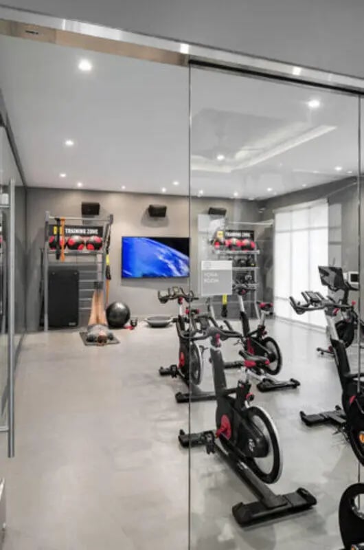 Spin bikes and equipment in gym at Stadium Enclave in Tallahassee Student Accommodation