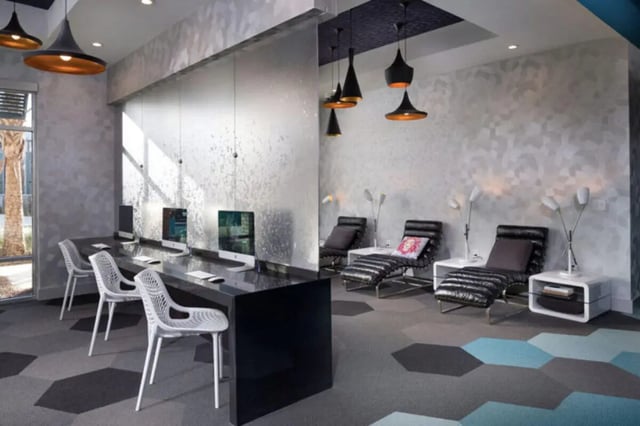 Computers chairs chaise lounges lounge area at Stadium Enclave in Tallahassee Student Accommodation