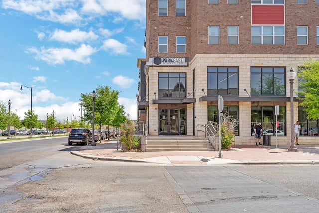 Building entrance with steps and parked cars exterior at Park East Student Living in Lubbock Student Accommodation