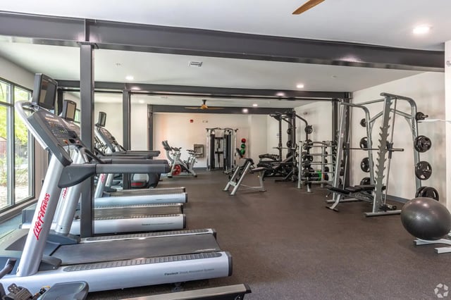 Treadmills weight machines exercise bikes gym area at Park East Student Living in Lubbock Student Accommodation