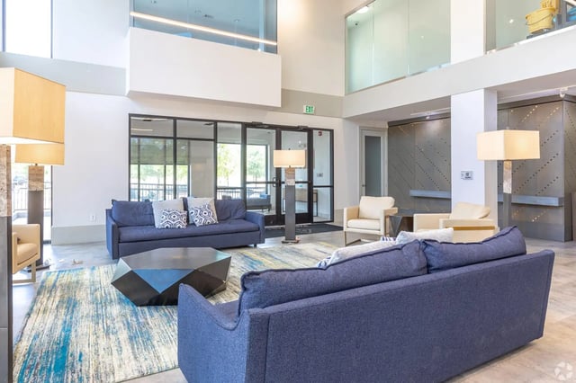 Sofas geometric table patterned rug living room at Park East Student Living in Lubbock Student Accommodation