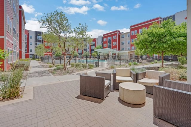 Courtyard seating with pool and buildings exterior at Park East Student Living in Lubbock Student Accommodation