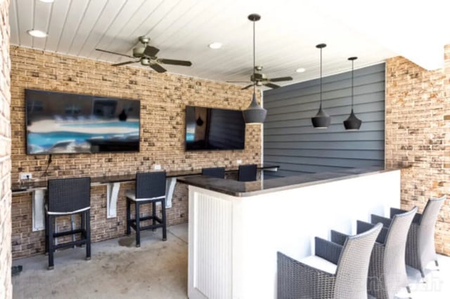 Two TVs bar and chairs area at Stadium View in Jonesboro Student Accommodation