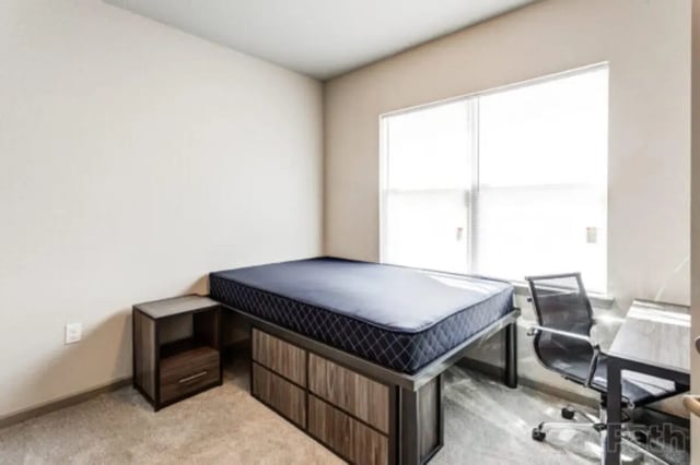 Bed nightstand desk chair with window bedroom at Stadium View in Jonesboro Student Accommodation