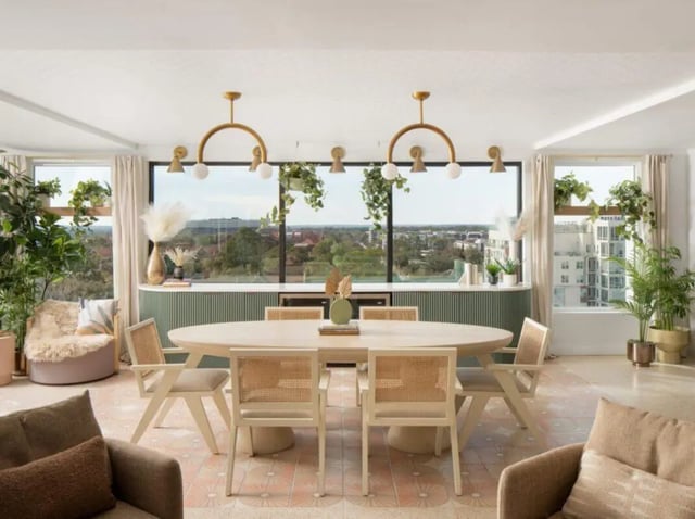 Oval dining table with chairs living area at Sweetwater Gainesville Apartments in Gainesville Student Accommodation