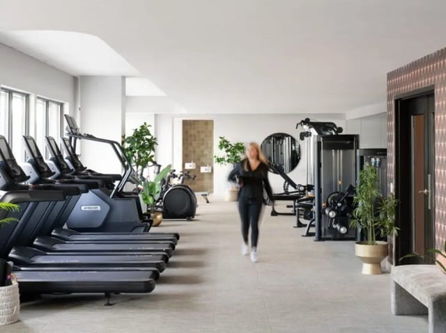 Treadmills and weight machines fitness area at Sweetwater Gainesville Apartments in Gainesville Student Accommodation