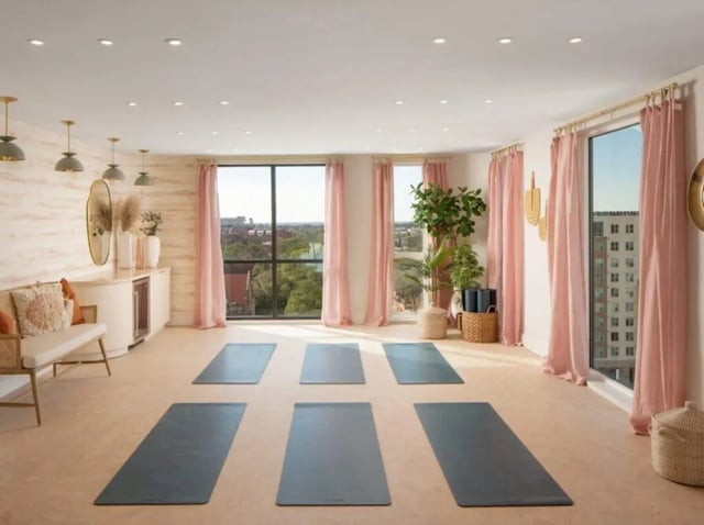 Yoga mats in a bright room living room at Sweetwater Gainesville Apartments in Gainesville Student Accommodation