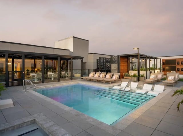 Swimming pool with lounge chairs and tables. Image Type: Recreation area. at Sweetwater Gainesville Apartments in Gainesville Student Accommodation