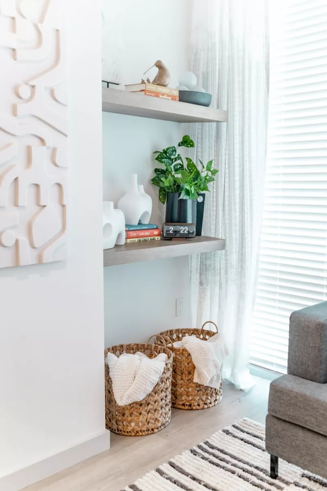 Shelves with decor plant clock baskets living room at Lapis in Miami Student Accommodation