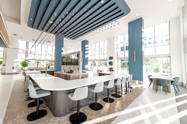 Bar with stools and table seating area at Lapis in Miami Student Accommodation