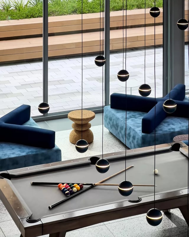 Pool table blue seating modern lights playing area at Lapis in Miami Student Accommodation
