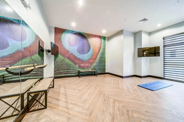Mirror barre wall art and yoga mat area at University Edge and Dickinson Lofts in Greenville Student Accommodation