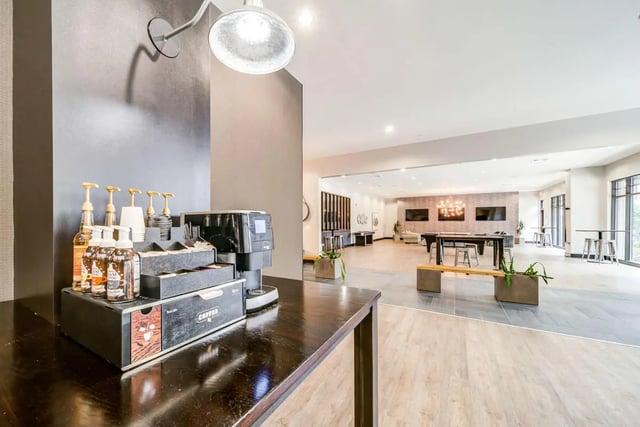 Coffee station syrups cups and coffee maker lounge area at University Edge and Dickinson Lofts in Greenville Student Accommodation