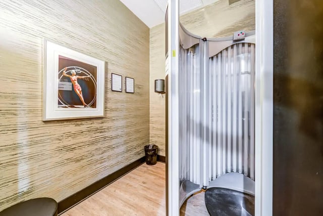 Tanning bed and artwork in room. at University Edge and Dickinson Lofts in Greenville Student Accommodation