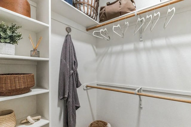 Closet with robe plant baskets and hanging clothes closet at The Village on Telluride in San Marcos Student Accommodation
