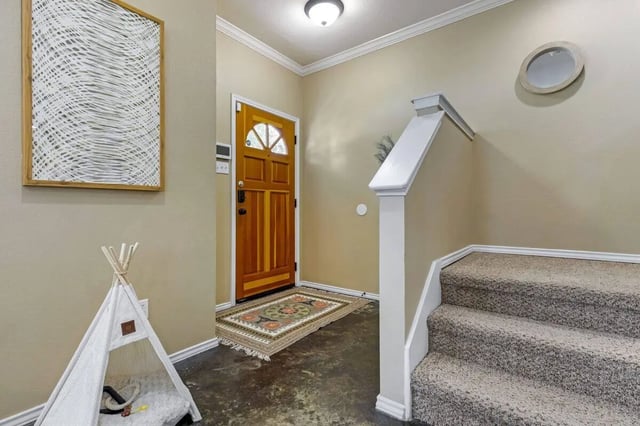 Wooden door teepee rug staircase entryway at The Village on Telluride in San Marcos Student Accommodation