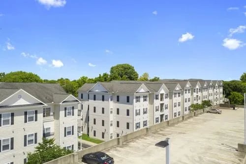 Apartment buildings with parking lot exterior at Registry Apartments in Bowling Green Student Accommodation