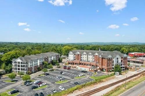 Apartment buildings with parking lot and trees exterior at Registry Apartments in Bowling Green Student Accommodation