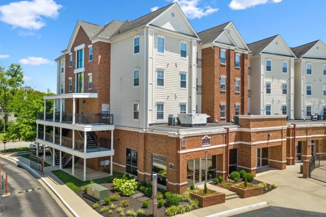 Brick and siding building with balconies and exterior stairs exterior at Registry Apartments in Bowling Green Student Accommodation