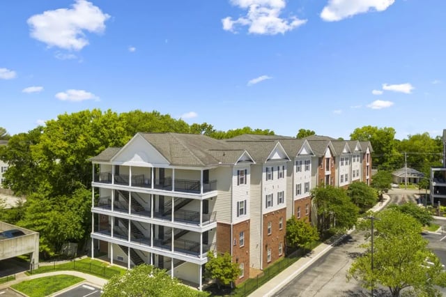 Building with balconies stairs and parking exterior at Registry Apartments in Bowling Green Student Accommodation