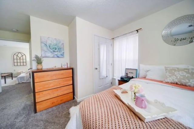 Bed with tray dresser and art Bedroom at The Everson in Cullowhee Student Accommodation