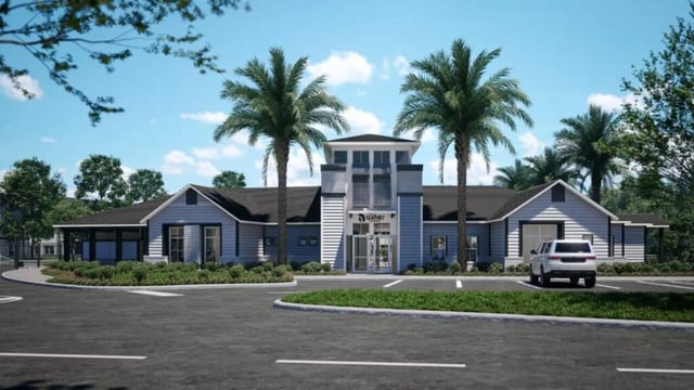 Modern building with palm trees and car exterior at The Asher in Tallahassee Student Accommodation