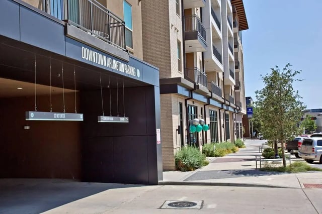 Apartment building entrance with parking sign exterior at 101 Center in Arlington Student Accommodation