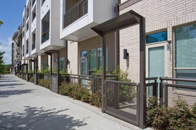Modern building with balconies and exterior entrances exterior at 101 Center in Arlington Student Accommodation