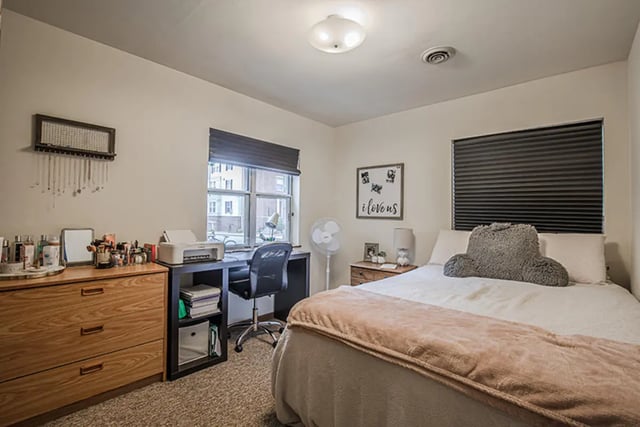 Desk printer bed dresser with decor bedroom at College Park Apartments in Ithaca Student Accommodation