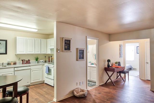Kitchen desk and bedroom beyond living area at Launch Apartments in West Lafayette Student Accommodation