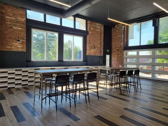 High tables with bar stools living room at Launch Apartments in West Lafayette Student Accommodation