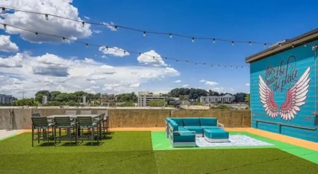 Rooftop patio dining area and lounge area exterior at The Flats at Atlantic Station in Atlanta Student Accommodation