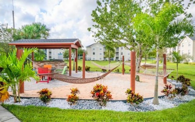 Hammocks under canopy with seating outdoor area at The Pointe at Central in Orlando Student Accommodation