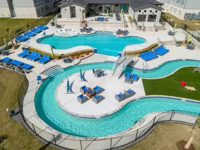 Swimming pool lazy river and lounge chairs exterior at The Pointe at Pinhook in Lafayette Student Accommodation